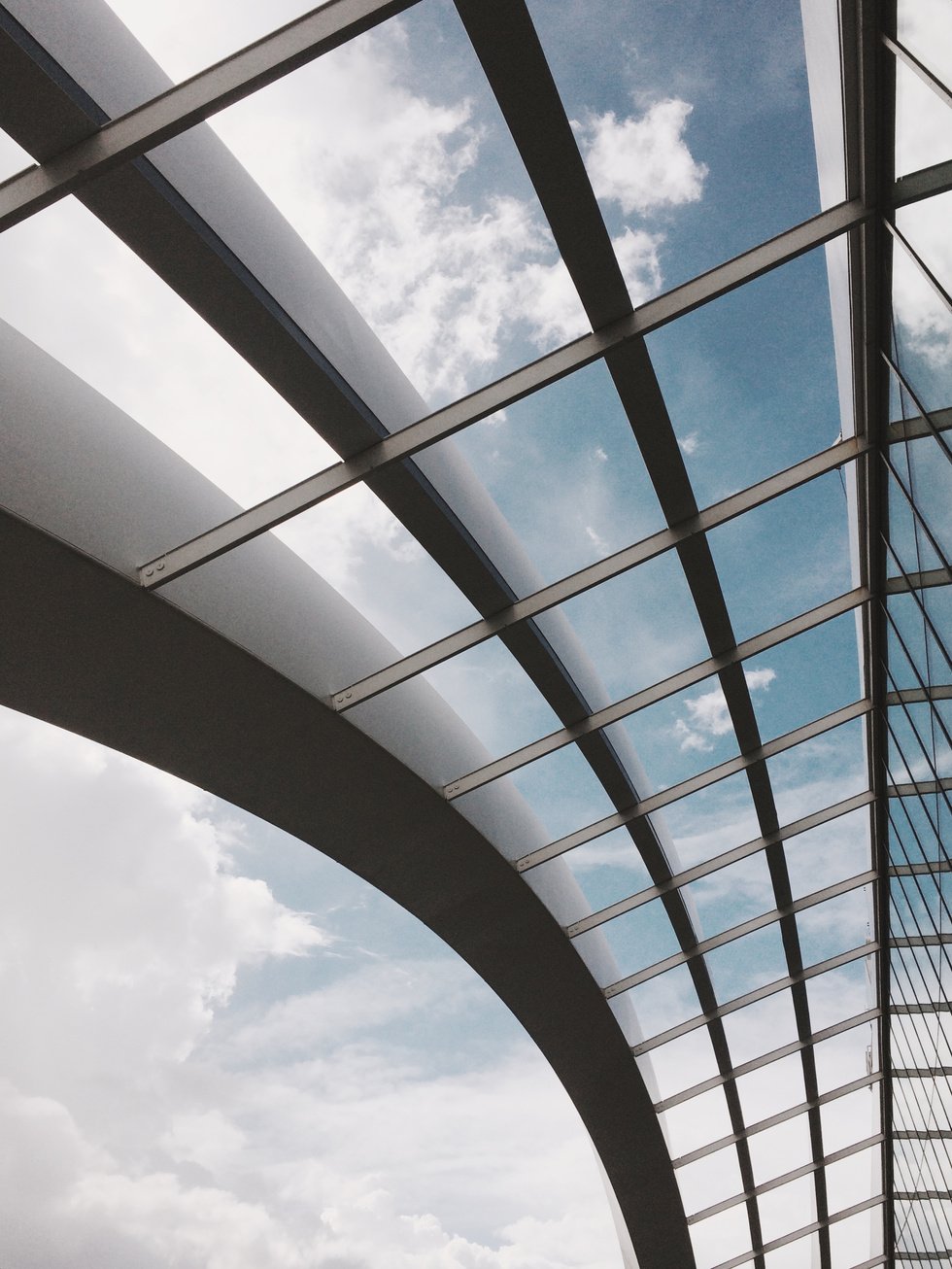 Low-angle Photography of Building Under White Clouds and Blue Sky